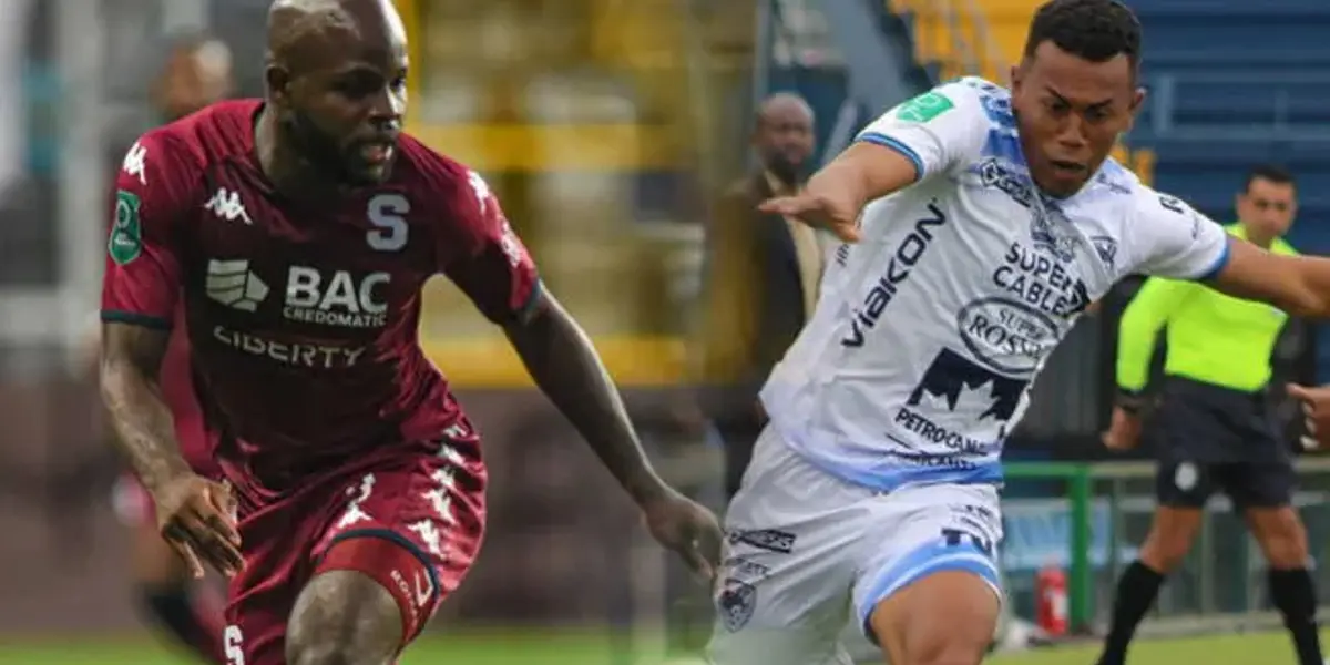 El delantero Javon Eats al lado del jugador de Grecia